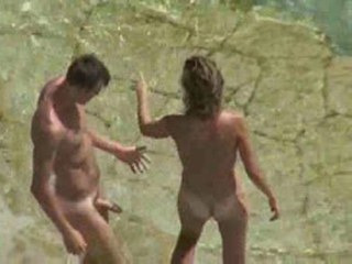Hot nudist couple fucking on the beach